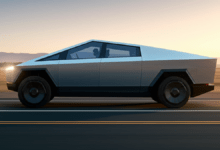 Tesla Cybertruck stainless steel electric pickup truck in dramatic lighting 2026